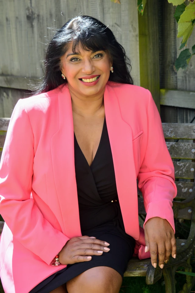 Sheena Hemens wearing a pink jacket.